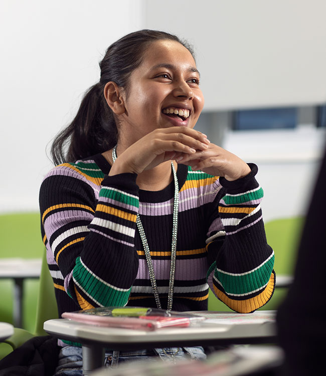 A close up of a smiling student